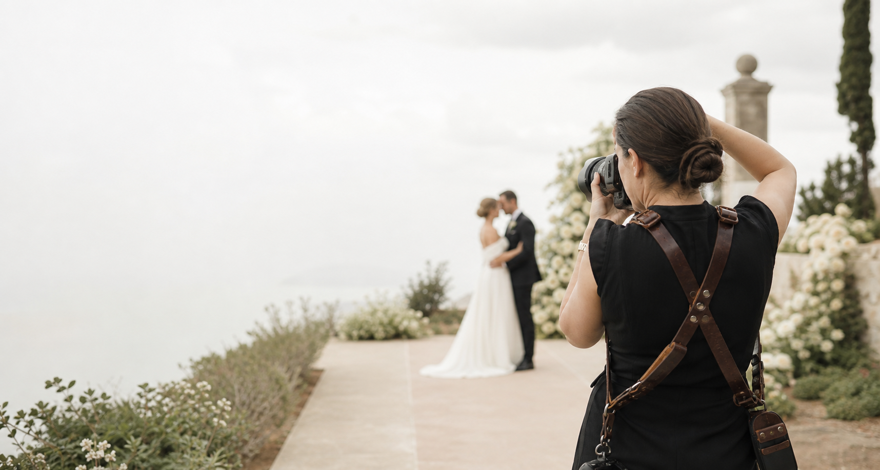 Wedding photographer capturing a couple